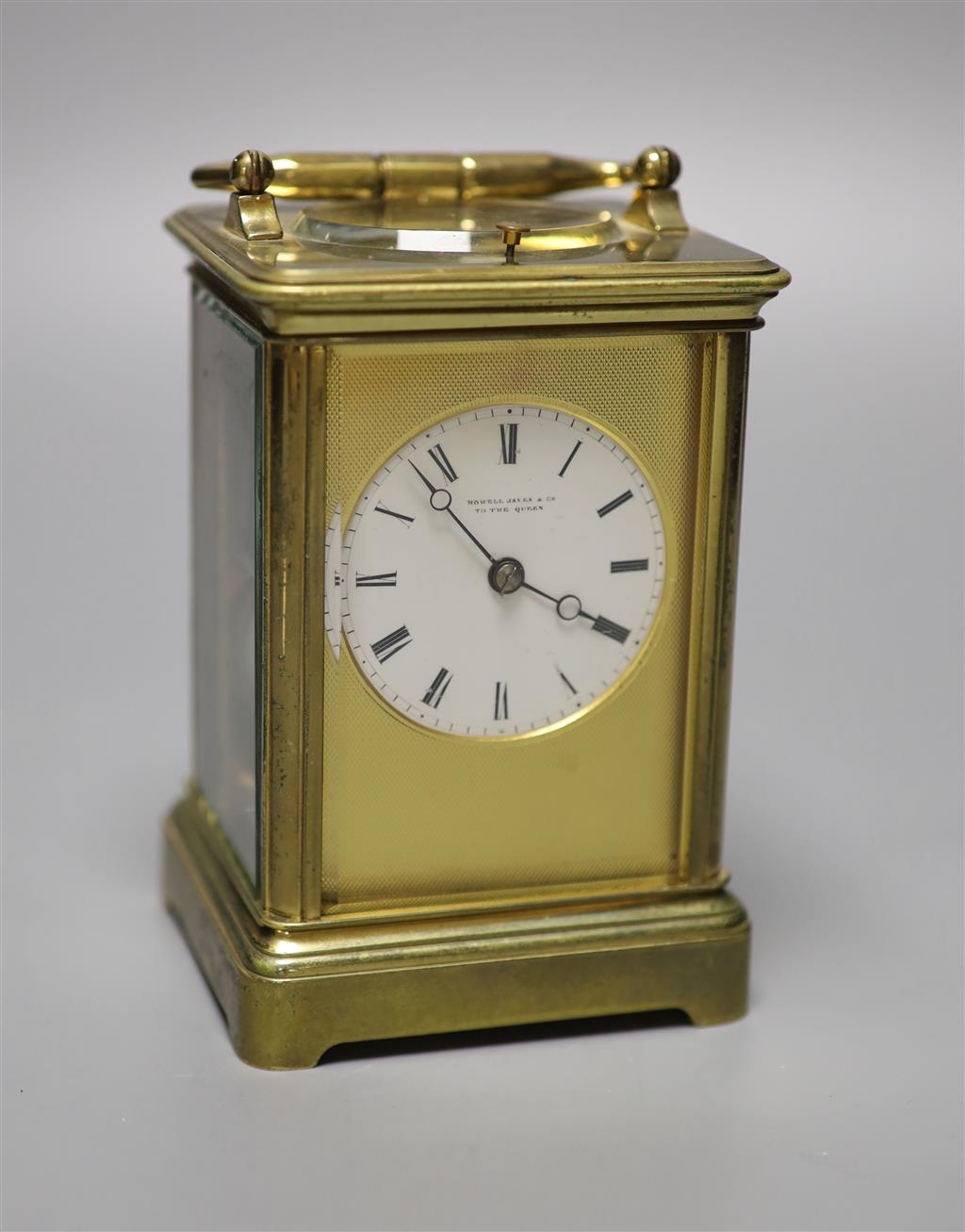 A brass carriage clock by Howell James & Co, height with handle down 13.5cm